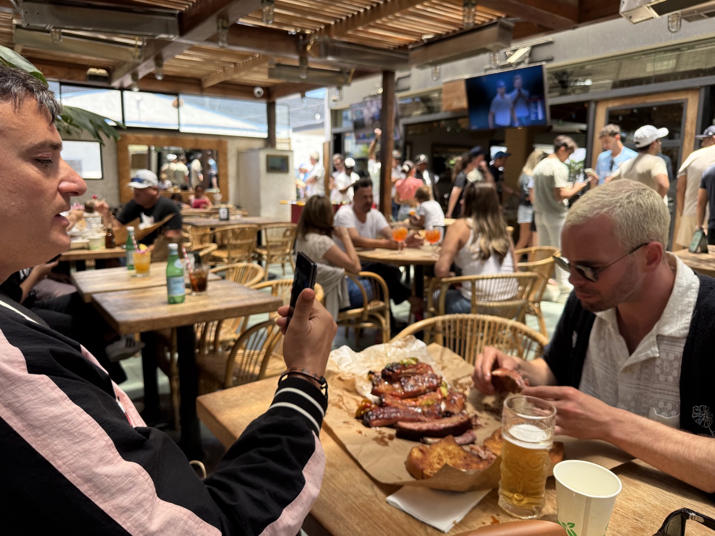 A Bite Twice creator filming the food at the table